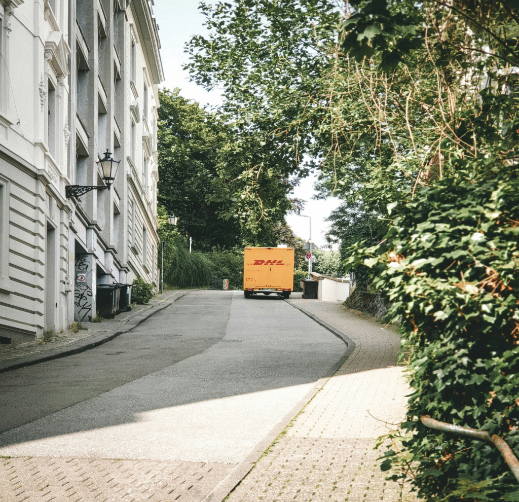 Delivery vehicle operating in an urban environment as part of an AI-managed logistics fleet