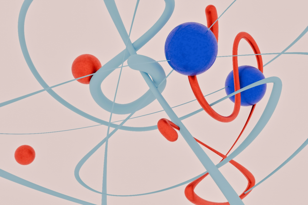 Abstract 3D illustration of interconnected red and blue spheres with curved orbital lines, representing qubits interacting within a stable and resilient quantum system.