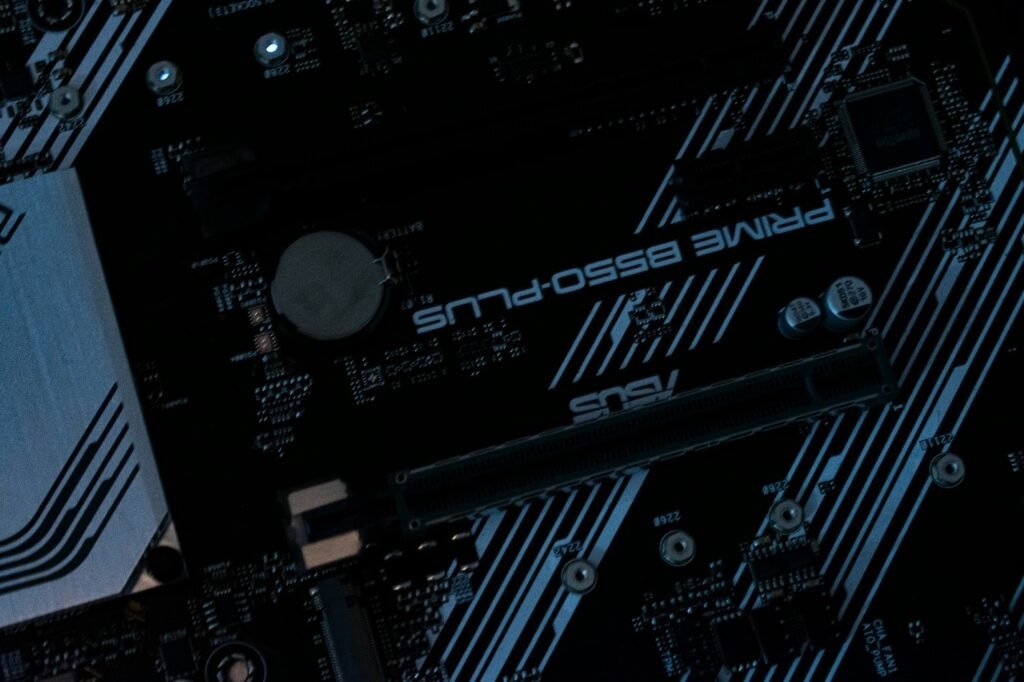 Close-up of computer motherboard with ASUS Prime B550-Plus chipset highlighting high-performance networking hardware