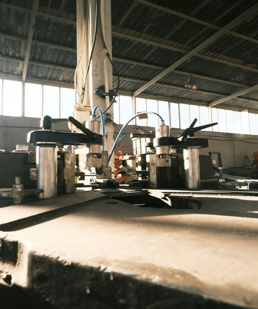 Automated manufacturing equipment operating on a factory production line, demonstrating AI-driven industrial automation and smart manufacturing processes.