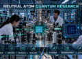 Researchers operating optical tweezers, lasers, and a vacuum chamber containing a programmable neutral-atom array.